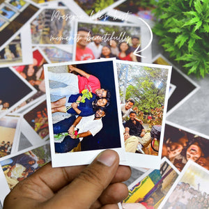 Hand holding Mayii custom polaroid prints with vibrant photos of friends and happy moments