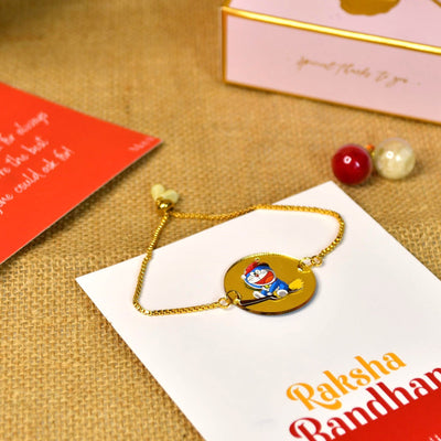 Mayii Exquisite Doraemon Rakhi Pack of 1 with Roli Chawal and Greeting card combo for Raksha Bandhan and Gifting