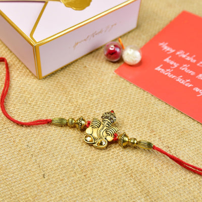 Mayii Exquisite Golden Ganesha Rakhi Pack of 1 with Roli Chawal and Greeting card combo for Raksha Bandhan and Gifting