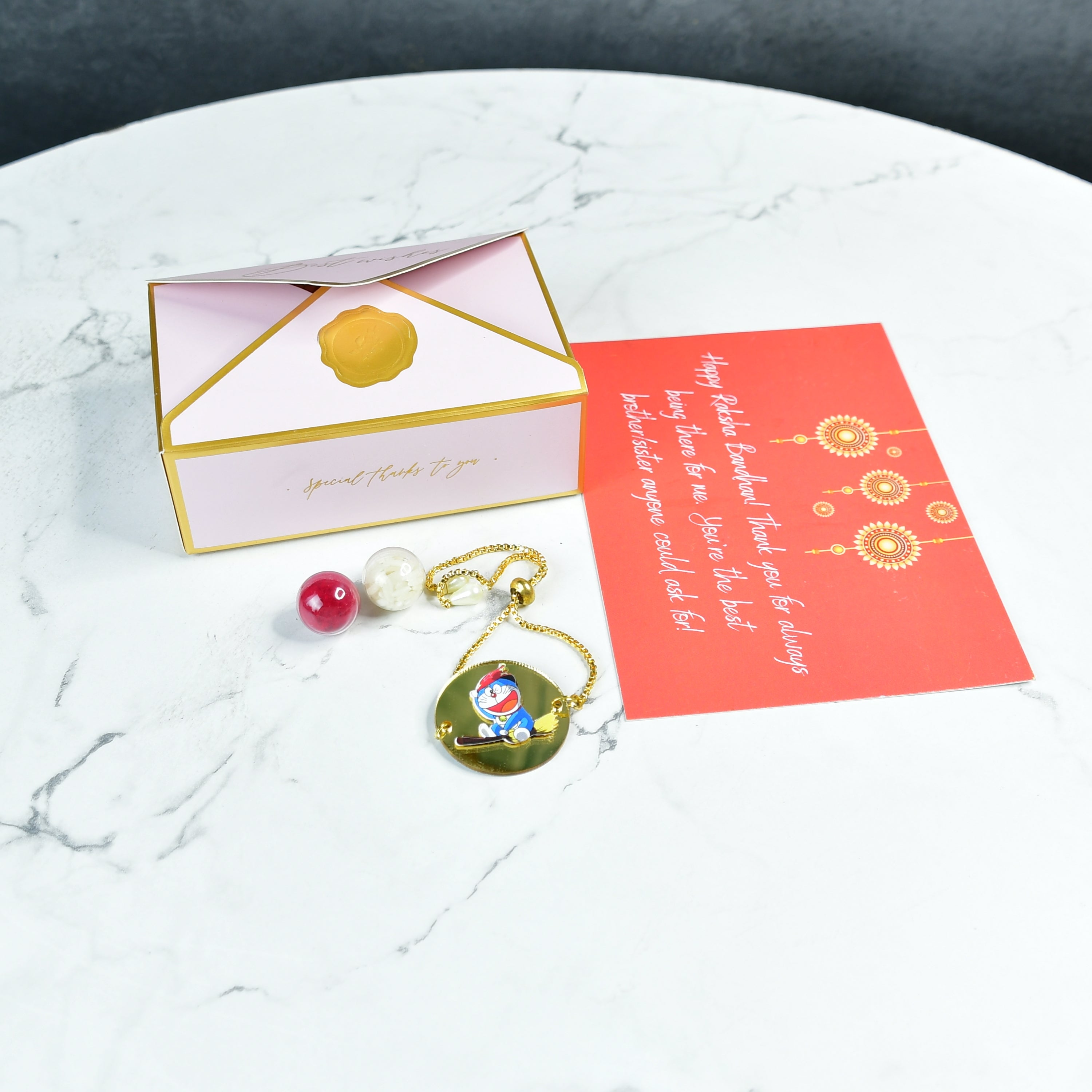 Mayii Exquisite Doraemon Rakhi Pack of 1 with Roli Chawal and Greeting card combo for Raksha Bandhan and Gifting - Mayii - Mayii