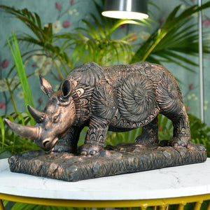 MAYII rhino home decor statue tabletop sculpture with intricate carved patterns on a decorative base